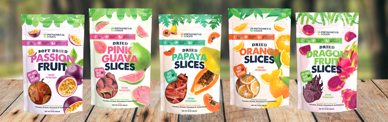 Five packages of dried fruit slices on a wooden surface with a blurred natural background
